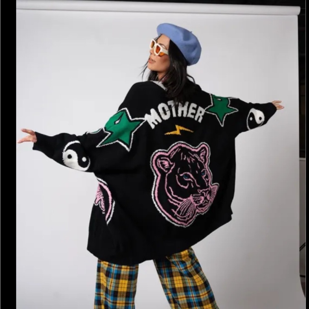 Dressed in LaLa iconic Mother cardigan